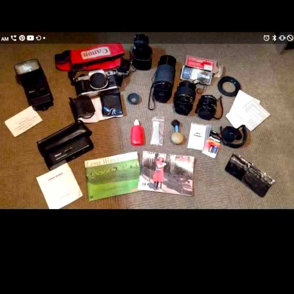 Canon ae 1 program camera with lenses and other accessories